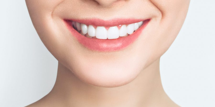 Perfect healthy teeth smile of a young woman. Teeth whitening. Dental clinic patient. Image symbolizes oral care dentistry, stomatology. Dentistry image