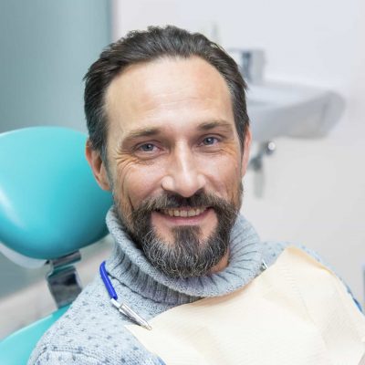 Smiling man in dental chair